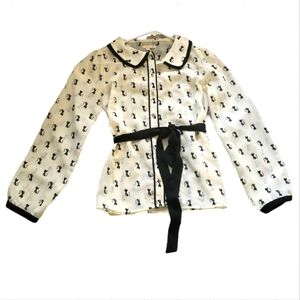 Blouse with Black Kitty cats on it.